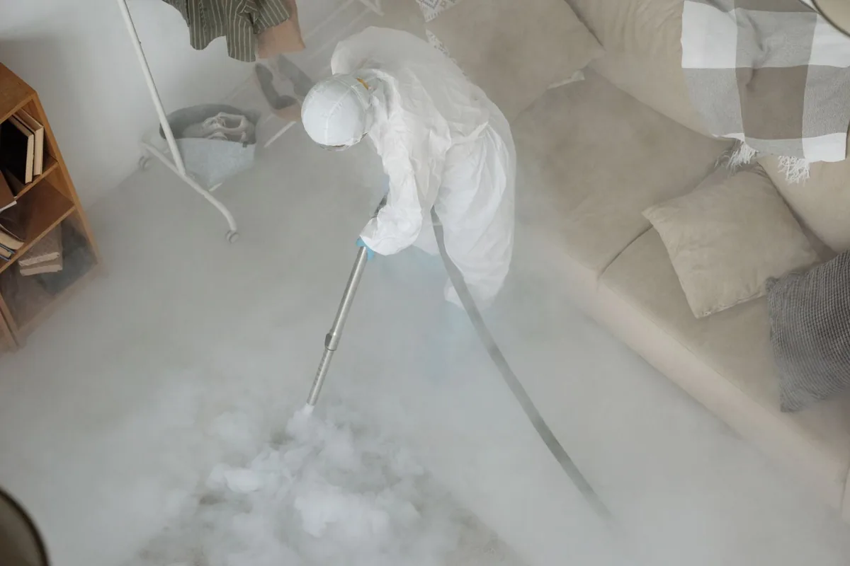 Biohazard cleanup technician in protective equipment, Roscommon, MI